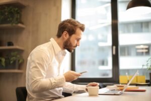 Man Struggling To Focus At Laptop With Adhd